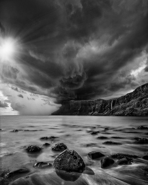 Stormy sky and sunshine at Talisker Bay Beach in Isle of Skye Scotland