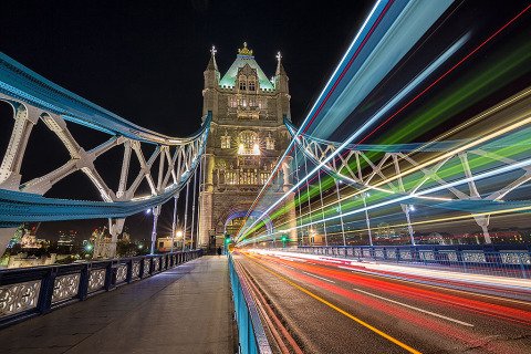 London Tower Bridge at night with car and bus light trails