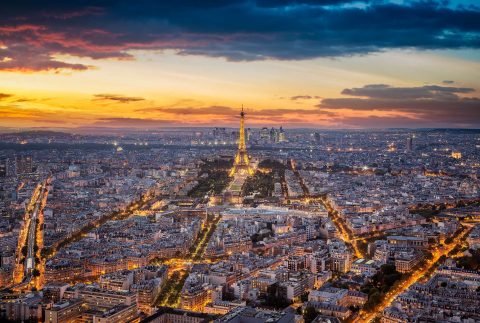 Paris city and Eiffel Tower at sunset night lights view from Montparnasse