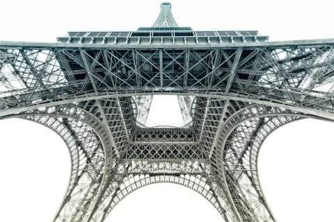 view of Eiffel Tower from below in muted color tones