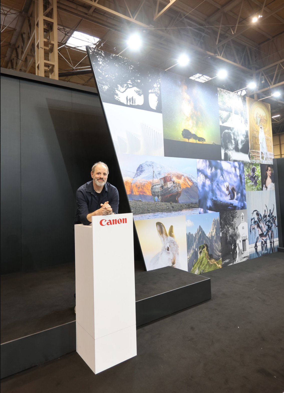 Antony Zacharias speaking at a Canon photography event