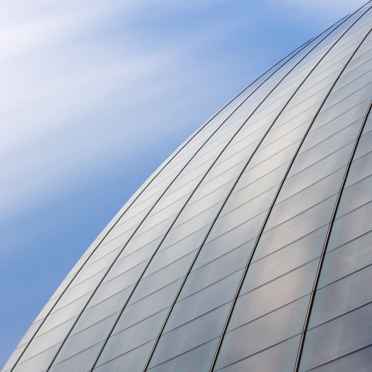 Minimal long-exposure architectural study in London with strong geometry and moving clouds.